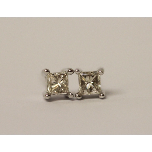 491 - A pair of princess cut diamond ear studs on 14ct white gold posts