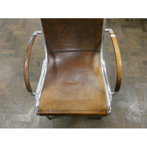 81 - A polished aluminium and brown leather designer elbow chair