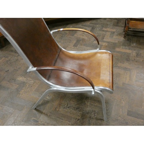 81 - A polished aluminium and brown leather designer elbow chair