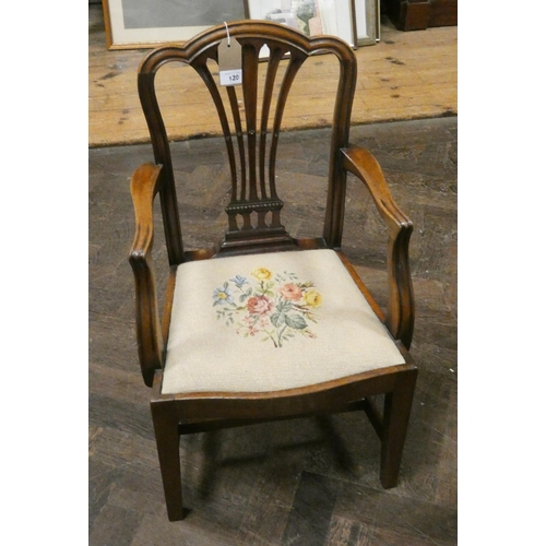 23 - A child's Chippendale style mahogany elbow chair with floral tapestry seat