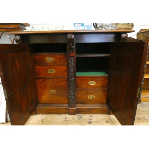 24 - A quality Victorian mahogany two door cabinet fitted five interior drawers and shelves with carved p... 