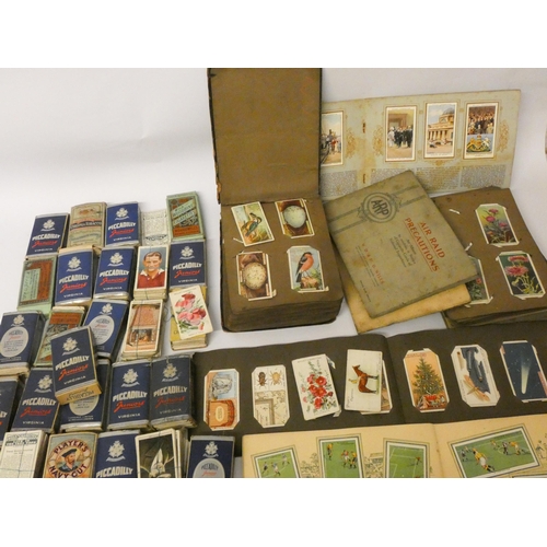 196 - A large collection of cigarette and tea cards, loose and in albums