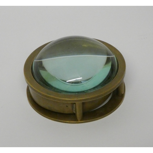 201 - A brass and bullseye glass mounted desk top compass