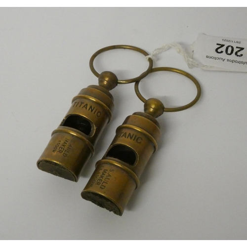 202 - Two vintage style brass whistles