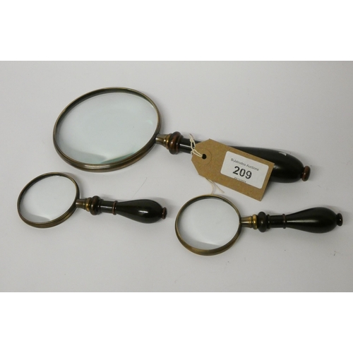 209 - A collection of three vintage style handheld magnifying glasses