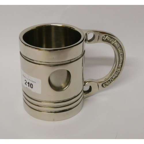 210 - A novelty silver plated spanner handle mug