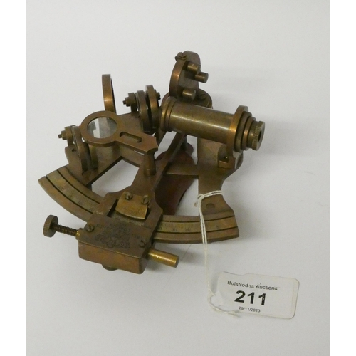 211 - A small brass sextant