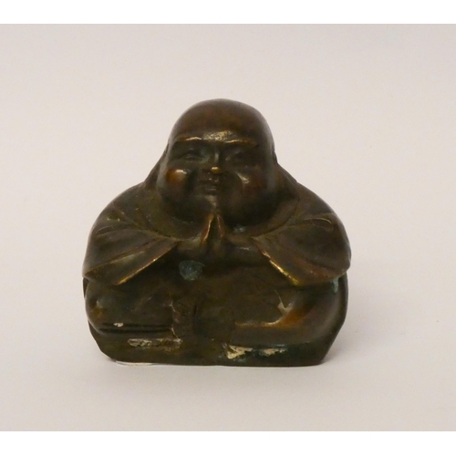 212 - A miniature bronze Buddha