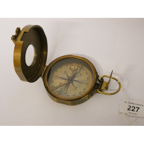 227 - A brass folding handheld compass