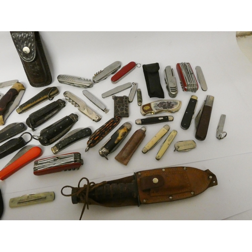 228 - A vintage penknife collection and an HMS Carinthia penknife