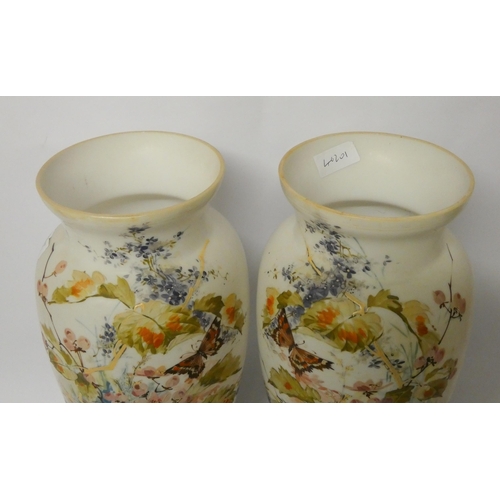 234 - A pair of late Victorian opaline glass vases, hand enamelled with flowers and butterflies, 37.5 cms ... 