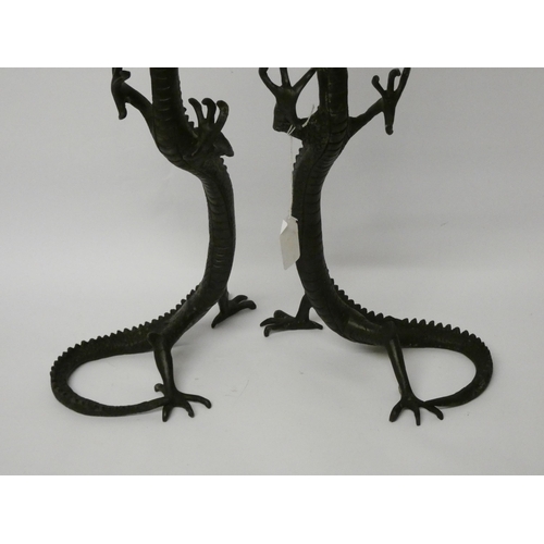 236 - A pair of Chinese bronze rearing dragons