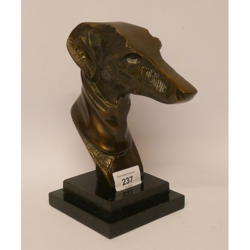 237 - A greyhound head statue on square onyx base