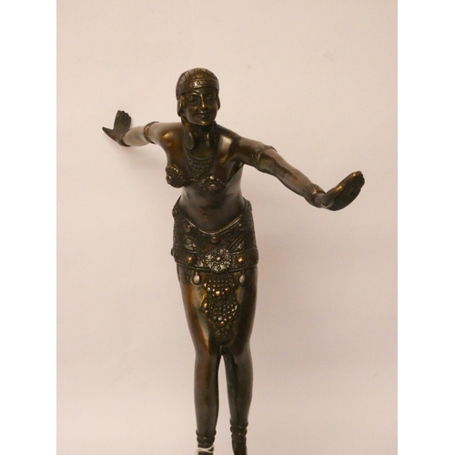 238 - A French Art Deco style bronze dancing lady figure on square stepped onyx base