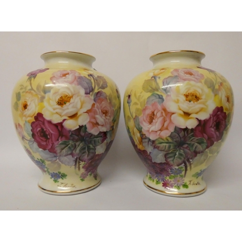 239 - A pair of Japanese hand painted bulbous vases decorated with roses and signed J Kato, 10