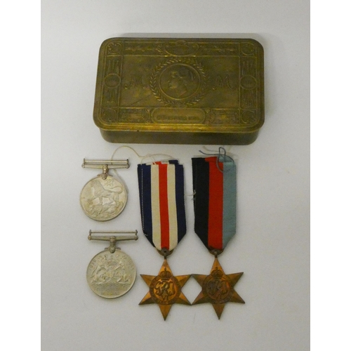 245 - Four World War II medals within a 1914 Christmas tin