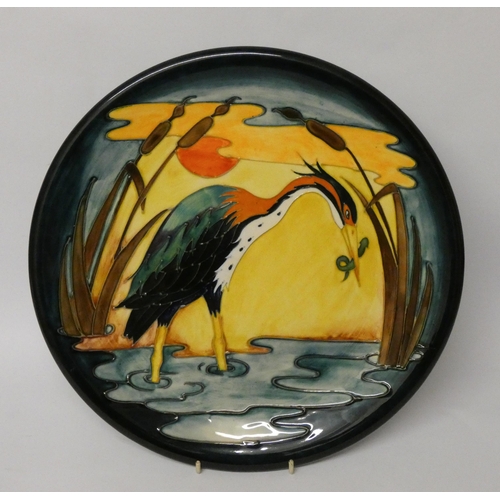 246 - A large Moorcroft wall plate decorated with a Heron, impressed marks, diameter 35cms