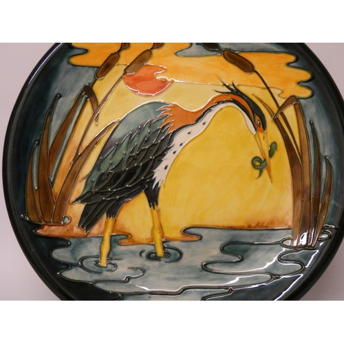 246 - A large Moorcroft wall plate decorated with a Heron, impressed marks, diameter 35cms