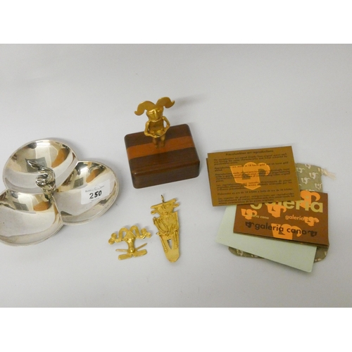 250 - A silver plated hor d'oeuvres dish and three pieces of Aztec inspired metal ware to include brooches... 