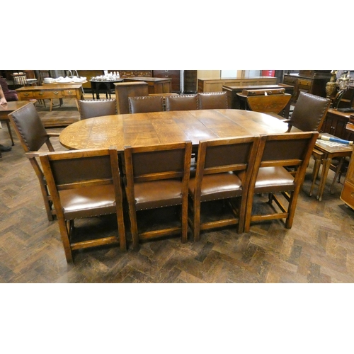 159 - Titchmarsh & Goodwin oval oak plank top dining table with centre leaf standing on bulbous legs with ... 