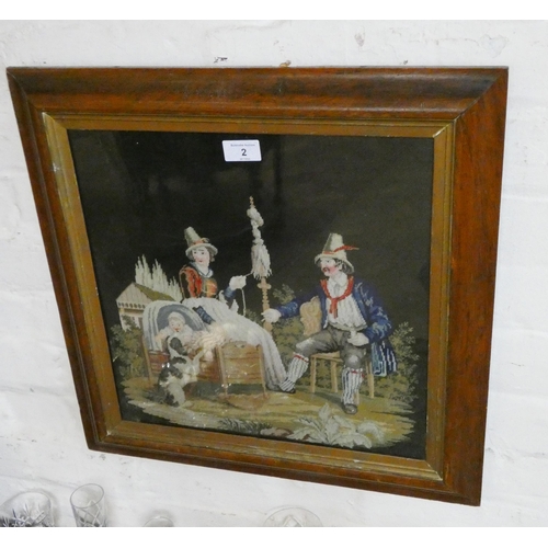 2 - A Victorian needlework tapestry picture of a family with a dog in a maple frame, overall size 20