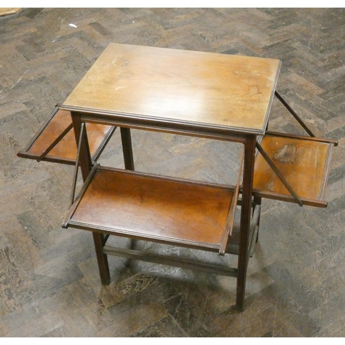 35 - An Edwardian walnut occasional table with fold-up sides and a square table top work box