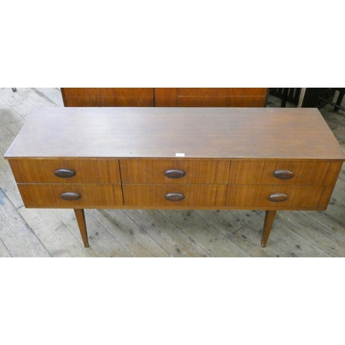 71 - A long low teak chest fitted six drawers, 5' wide