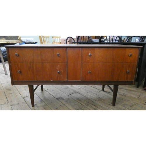 72 - A low teak chest fitted four drawers, 4'6 wide