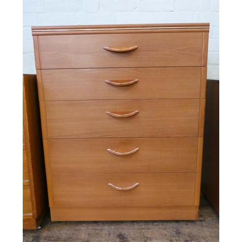 83 - A modern teak chest of five long drawers, 2'6 wide together with an oak chest of four drawers