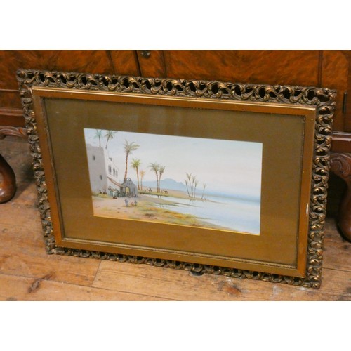 26 - A pair of gilt framed watercolours of Arabian desert scenes, signed J Moniti, image size 9