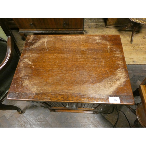 119 - An Old Charm oak bedside cabinet with linen fold panel doors (top is marked)