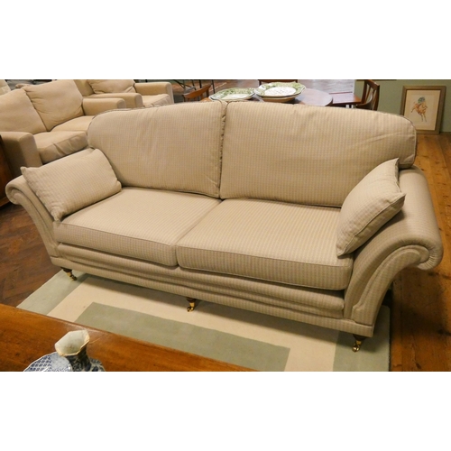 167 - A pair of country house large two seater sofas in durable neutral fawn upholstery, on turned mahogan... 