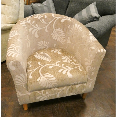 173 - A small tub shaped easy chair in fawn and cream leaf decorated covering