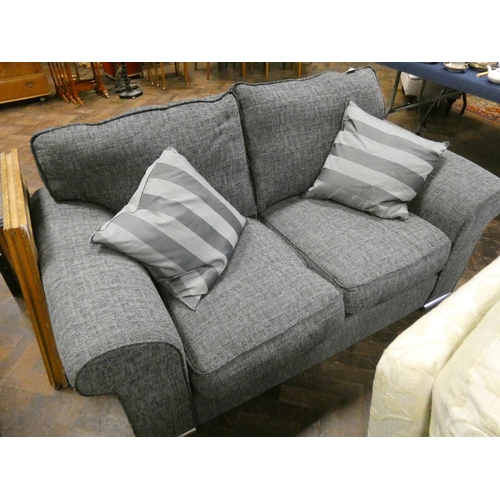 177 - A modern two seater sofa in charcoal grey with loose cushions