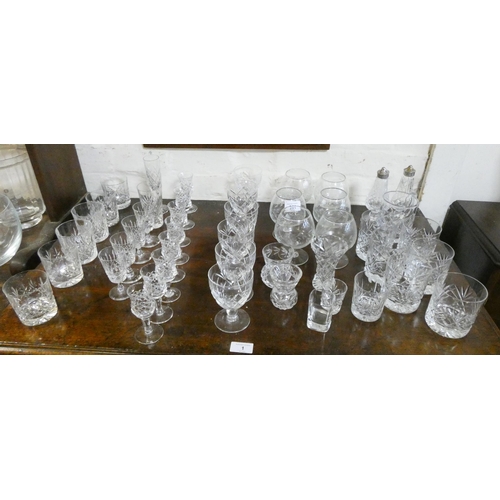 251 - A large collection of cut glass tumblers, brandy balloons, sherry glasses etc