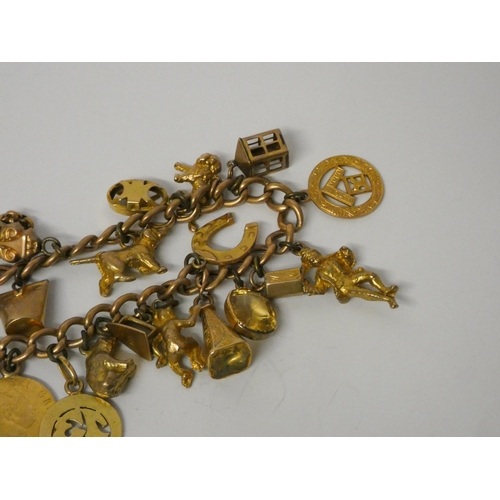 410 - 9ct gold curb link charm bracelet set with 1820 half sovereign, set with 19 other charms to a heart ... 