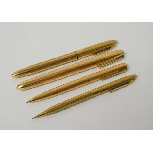 420 - A collection of four gold plated vintage fountain pens and propelling pencils