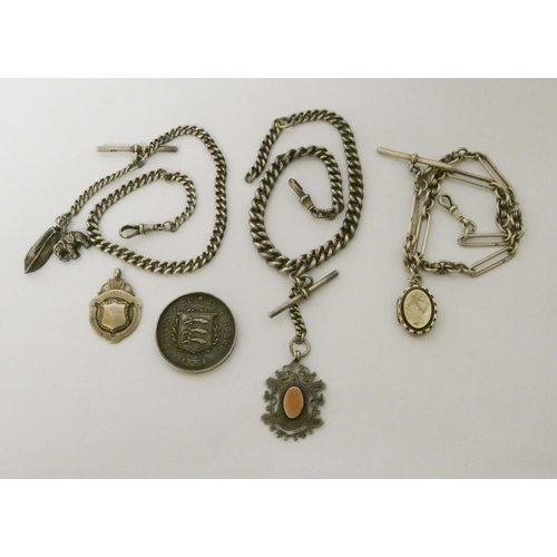 422 - Three late Victorian Edwardian watch Albert chains with medallions, fobs and charms, 161gms