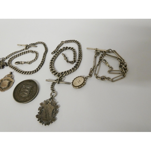 422 - Three late Victorian Edwardian watch Albert chains with medallions, fobs and charms, 161gms