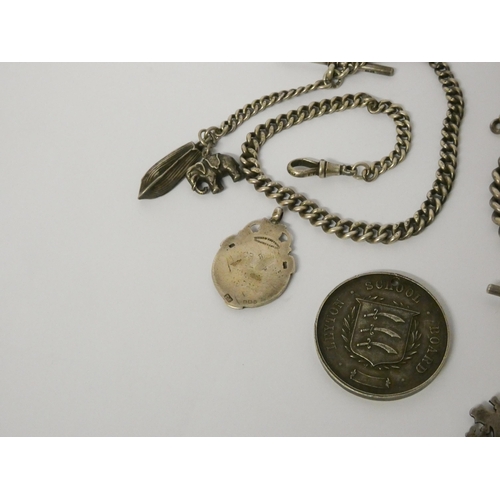 422 - Three late Victorian Edwardian watch Albert chains with medallions, fobs and charms, 161gms