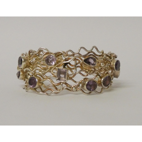 457 - A wide bespoke made silver and wirework amethyst set bangle. 31mm wide, gross weight 58 grams