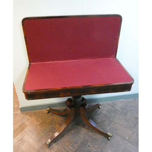 27 - Early 19th century rosewood inlaid fold over top card table on down swept pillar base, red baize lin... 