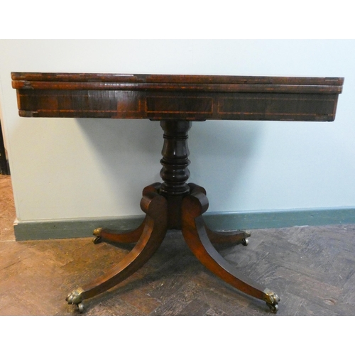 27 - Early 19th century rosewood inlaid fold over top card table on down swept pillar base, red baize lin... 