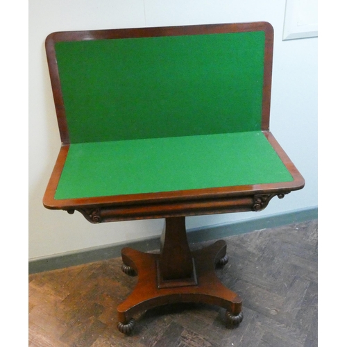 30 - A Victorian mahogany fold over top card table on pillar and platform base. Green baize lined