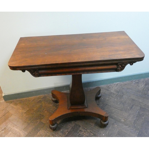 30 - A Victorian mahogany fold over top card table on pillar and platform base. Green baize lined