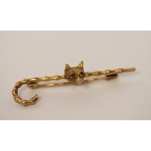 403 - Victorian gold unusual stock pin. Modelled as a walking cane with  fox mask with ruby eyes. In fitte... 