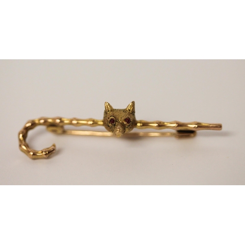 403 - Victorian gold unusual stock pin. Modelled as a walking cane with  fox mask with ruby eyes. In fitte... 