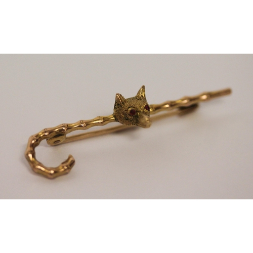 403 - Victorian gold unusual stock pin. Modelled as a walking cane with  fox mask with ruby eyes. In fitte... 