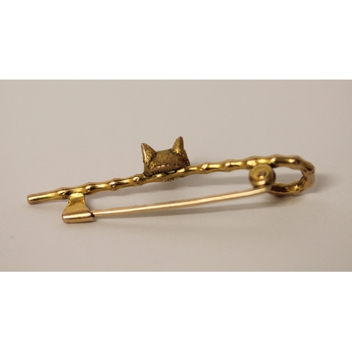 403 - Victorian gold unusual stock pin. Modelled as a walking cane with  fox mask with ruby eyes. In fitte... 