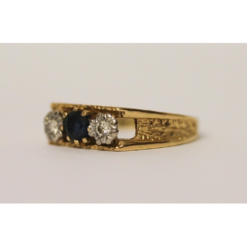 411 - 18ct gold three stone sapphire and diamond ring. Hallmarked, ring size O, 3.6 grams